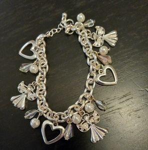 Beautiful silver tone charm bracelet with angels, hearts, beads & faux pearls.